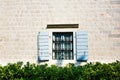 Window with Open Wooden Shutters.