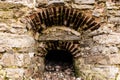 Window opening in a stone wall. Royalty Free Stock Photo