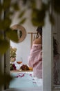 Window outside view of the bath tub, grapefruit slices, bunch of grapes, a glass of wine and a woman, selective focus Royalty Free Stock Photo