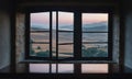 A window overlooking a rolling landscape, with a misty horizon in the distance Royalty Free Stock Photo
