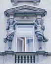 Window pediment with sculptures Royalty Free Stock Photo