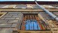 Window Pilaster and Downpipe of an Old Black Building