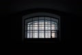 A window in a prison cell, covered with bars. Royalty Free Stock Photo