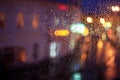 Window rain blurred city lights Royalty Free Stock Photo