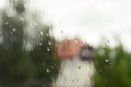 Window with rain drops with wiev on a forest and house Royalty Free Stock Photo
