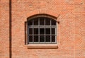 The window in red brick wall. Royalty Free Stock Photo