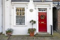 Window with red shutters, decorated with a drawing with a horse in a traditional Christmas style about south bank in London