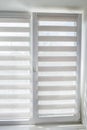 Window roller duo system day and night. Close up on roll curtains indoor. Royalty Free Stock Photo