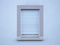 Window with roller shutter