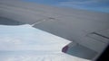 Window seat view of ailerons move as the pilot maneuvers the jet