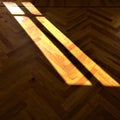 Window, shadow, light and herringbone parquet