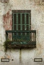 Window with a shutter and a balcony
