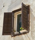 Window with shutter in the old town of Rab in Croatia Royalty Free Stock Photo