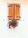 window with shutters and flowers pots. Vintage window with geranium flowers. Royalty Free Stock Photo