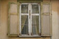 Window with shutters. Old house