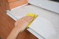 Window Sill Cleaning from Dust. Cleaning Your Windows and Window Sills. Royalty Free Stock Photo