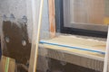 Window sill corner contruction with foam insulation, plastering layers, reinforcment mesh, finishing render