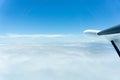 Through window of small plane flying above clouds Royalty Free Stock Photo