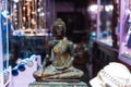 In the window is a small Buddha statue partially covered in gold Royalty Free Stock Photo