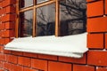 Window with snow on its windowsill