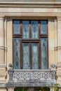 Window stained glass window with a balcony in Peles Castle in Romania Royalty Free Stock Photo