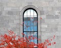 Window In Stone Building And Coloured Leaves