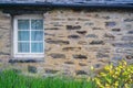 Window in a stone wall Royalty Free Stock Photo