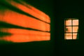 Window with a sunlight reflecting on the wall. Orange cenarium. Pop filter technique..