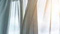 Window transparent curtains waved by light wind closeup