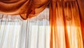 Window with transparent white tulle beige curtains. Background and texture with fabric and copy space for text