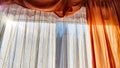 Window with transparent white tulle beige curtains. Background and texture with fabric and copy space for text