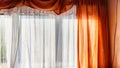 Window with transparent white tulle beige curtains. Background and texture with fabric and copy space for text