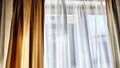 Window with transparent white tulle beige curtains. Background and texture with fabric and copy space for text