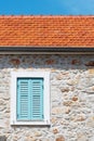 Window with turquoise window blinds on an old mediterranean house Royalty Free Stock Photo