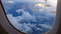 Window View on Airplane, Wing of Airplane With Sunlight on Sky, Cloudy Background, Royalty Free Stock Photo