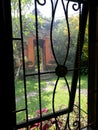 Window view of Balinese garden and side gate Royalty Free Stock Photo