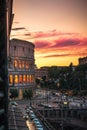 Window view at the colosseum of rome at sunset