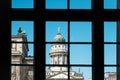 Window view on historic French Cathedral / Dome at Gendarmenmarkt, Berlin