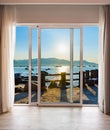 Window with a view of the ocean and mountains Royalty Free Stock Photo