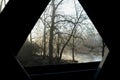 Window view from Wooden covered bridge on rural road Royalty Free Stock Photo