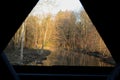 Window view from wooden covered bridge on rural road Royalty Free Stock Photo