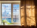 window of village house with houseplant on sill Royalty Free Stock Photo