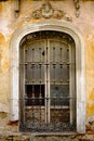 Window with vintage metal bars in a weathered old stone wall Royalty Free Stock Photo