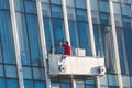 Window washer  cleaning the glass facade Royalty Free Stock Photo