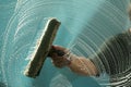 Window washer washing a window Royalty Free Stock Photo