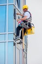 Window washer working at building outdoor Royalty Free Stock Photo