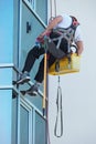 Window washer working at building outdoor Royalty Free Stock Photo