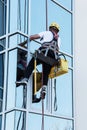 Window washer working at building outdoor Royalty Free Stock Photo