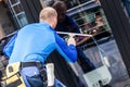 Window washer working at building outdoor Royalty Free Stock Photo