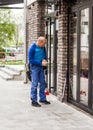 Window washer working at building outdoor